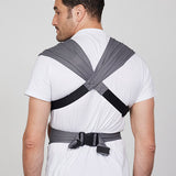 Back view of man wearing Izmi Breeze Baby Carrier showing crossed shoulder straps